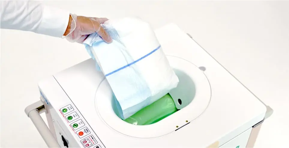 おむつを衛生的に密封するエコムシュウの機械本体。清潔な環境維持に貢献します。